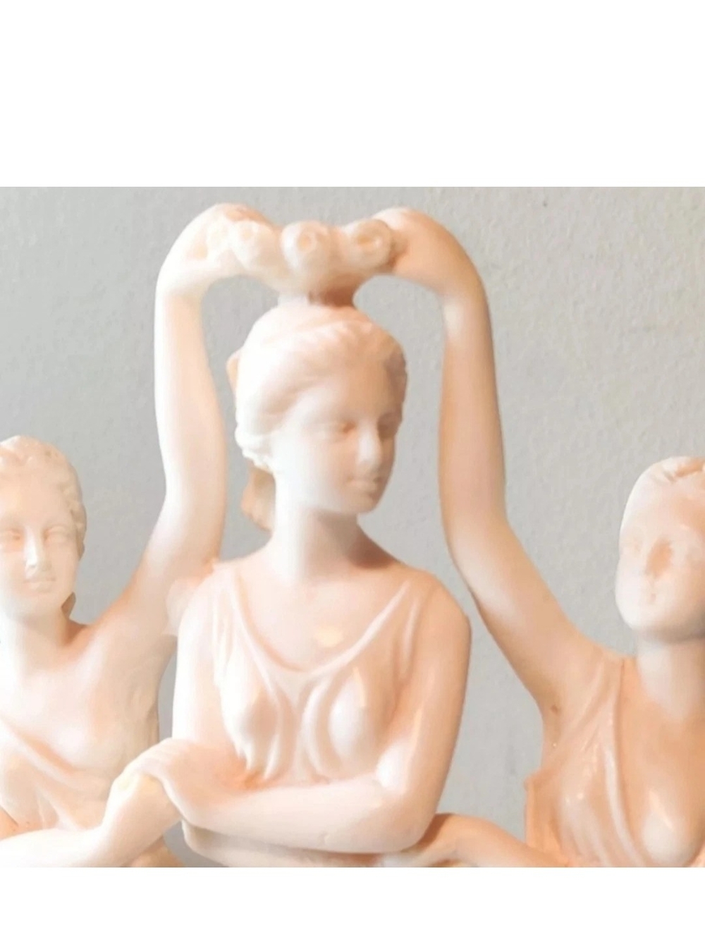 A. Santini sculptures are made  marble dust and resin. 